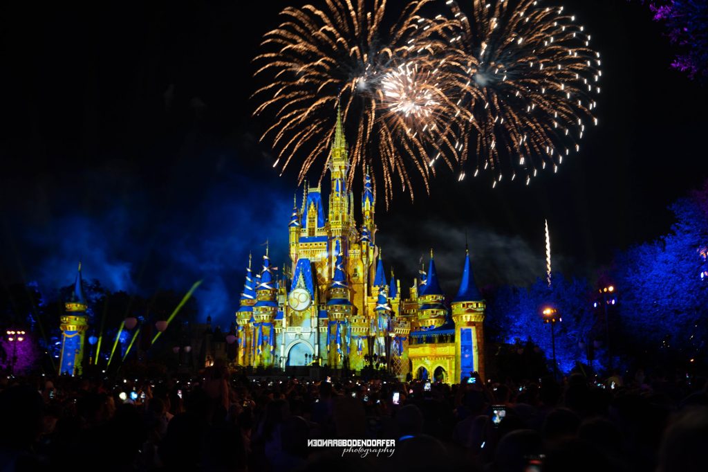 Fireworks burst over Cinderella Castle during a nighttime show at Magic Kingdom